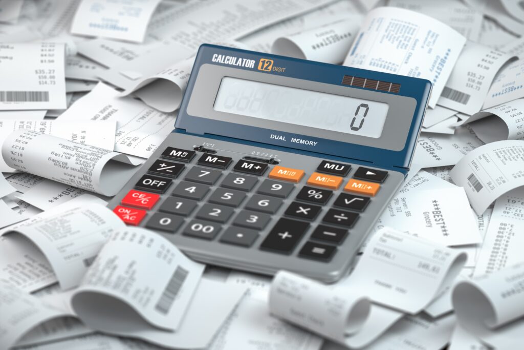 Messy bookkeeping with a calculator and lots of receipts